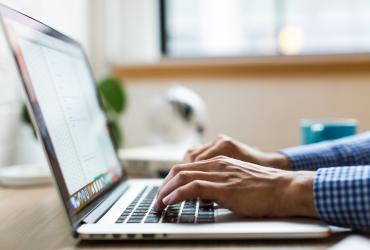hands-typing-on-laptop
